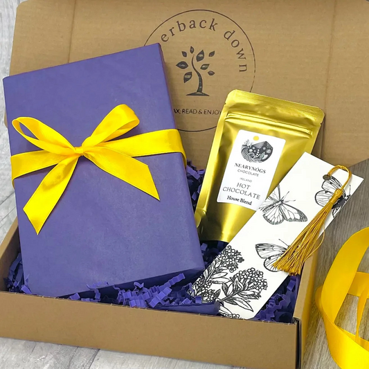 Blind Date With A Book Gift Box, contacting a new book, beautifully wrapped, a mini-pouch of drinking chocolate and a tassel bookmark.