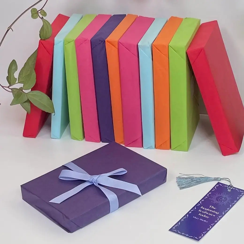 A beautifully wrapped book, tied with a bow, which will be a part of any gift subscription box ordered.
