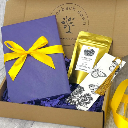Blind Date With A Book Gift Box, contacting a new book, beautifully wrapped, a mini-pouch of drinking chocolate and a tassel bookmark.