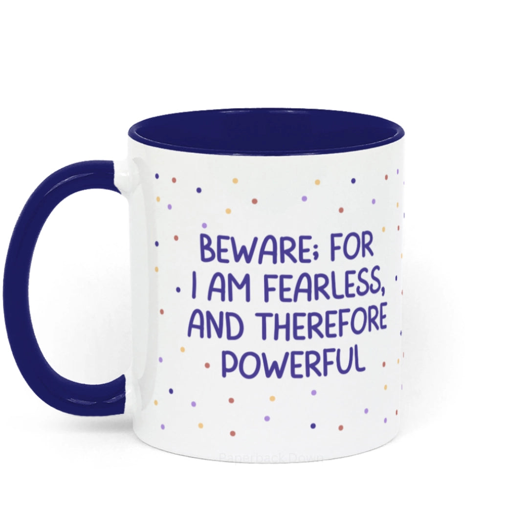 Image shows a mug for book lovers featuring the quote "Beware; For I am fearless, and therefore powerful" from Mary Shelley's Frankenstein. The mug is white and blue ceramic with blue writing against a polka dot background