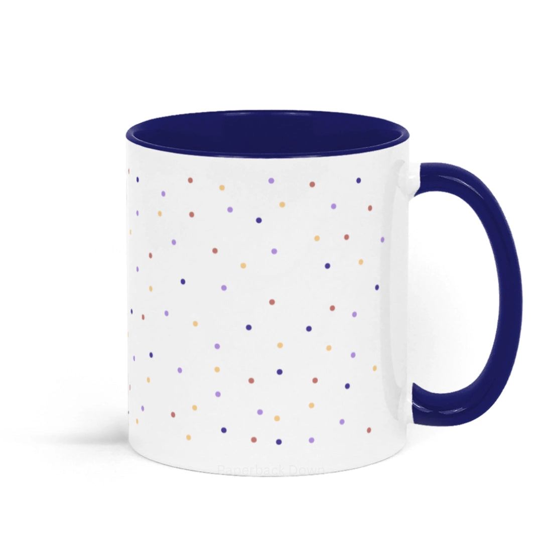 Image shows the back of a mug for book lovers featuring the quote "Beware; For I am fearless, and therefore powerful" from Mary Shelley's Frankenstein. The mug is white and blue ceramic with blue writing against a polka dot background