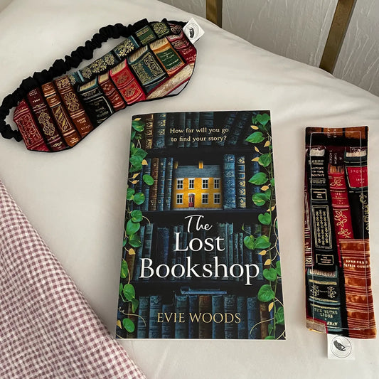 Image shows a gift set for readers, book-lovers and bibliophiles which comprises The Lost Bookshop by Evie Woods, plus a beautiful literary-themed sleep mask and a coordinating fabric bookmark.