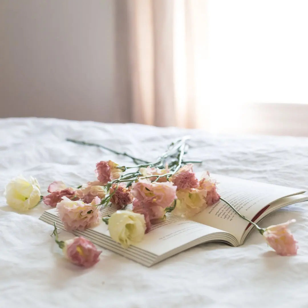 Valentines Day Gift Idea - a book lying open on a white bedspread